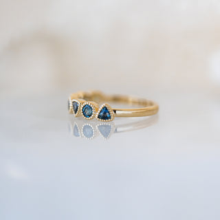 Trilliant and Round Teal Sapphire Band