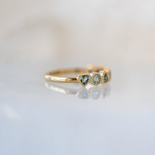 Trilliant and Round Teal Sapphire Band
