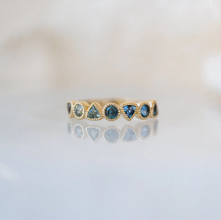 Trilliant and Round Teal Sapphire Band