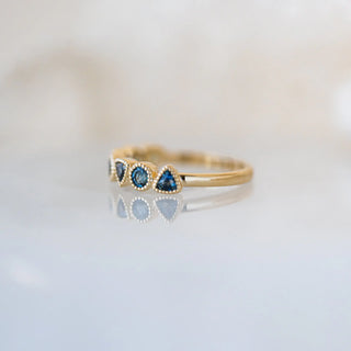 Trilliant and Round Teal Sapphire Band